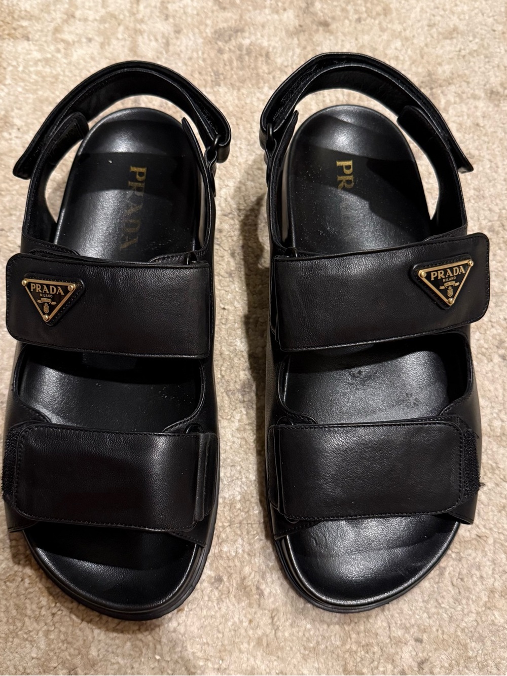 Prada Women’s Black Leather Dual-Strap Sandals with Gold Logo